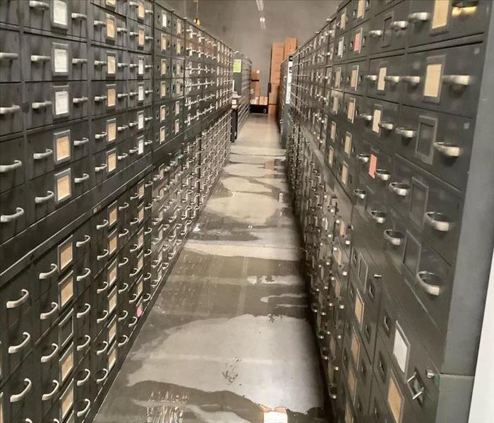 Standing water in warehouse aisle 