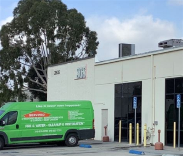 SERVPRO cargo van parked in front of commercial building 